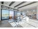 Bright living room with wood floors, beamed ceilings, large sliding glass doors and modern furnishings at 24642 N 123Rd Pl, Scottsdale, AZ 85255