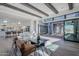 Bright living room with wood floors, beamed ceilings, large sliding glass doors and modern furnishings at 24642 N 123Rd Pl, Scottsdale, AZ 85255