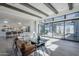 Bright living room with wood floors, beamed ceilings, large sliding glass doors and modern furnishings at 24642 N 123Rd Pl, Scottsdale, AZ 85255