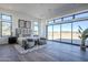 Bright main bedroom with large windows offering stunning views, featuring a sitting area at 24642 N 123Rd Pl, Scottsdale, AZ 85255