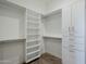 Spacious walk-in closet featuring custom shelving and storage solutions at 24642 N 123Rd Pl, Scottsdale, AZ 85255