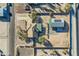 Aerial view of a house, detached garage with solar panels, and expansive desert lot at 2602 S 226Th Dr, Buckeye, AZ 85326