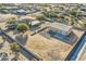 Aerial view of house and large detached shop on a spacious lot at 2602 S 226Th Dr, Buckeye, AZ 85326