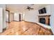 Hardwood floors and a cozy fireplace highlight this spacious bedroom at 2602 S 226Th Dr, Buckeye, AZ 85326