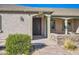 Front entry with decorative door and brick walkway at 2602 S 226Th Dr, Buckeye, AZ 85326