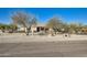 House with mature trees and a gravel driveway at 2602 S 226Th Dr, Buckeye, AZ 85326