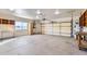 Spacious garage with built-in shelving and workbench at 2602 S 226Th Dr, Buckeye, AZ 85326