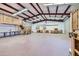 Large workshop with loft, storage, and roll-up door at 2602 S 226Th Dr, Buckeye, AZ 85326