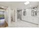 Modern bathroom featuring double vanity and view to bedroom at 26034 S Glenburn Dr, Sun Lakes, AZ 85248