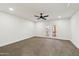 Well-lit bedroom with ceiling fan and French doors at 26034 S Glenburn Dr, Sun Lakes, AZ 85248