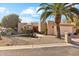 Attractive single-level home with desert landscaping and a two-car garage at 26034 S Glenburn Dr, Sun Lakes, AZ 85248