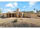 Ranch-style home with covered patio and desert landscaping at 26034 S Glenburn Dr, Sun Lakes, AZ 85248