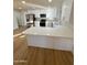 Modern kitchen featuring white cabinets, quartz countertops, and stainless steel appliances at 26034 S Glenburn Dr, Sun Lakes, AZ 85248