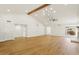 Open and airy living room with hardwood floors and recessed lighting at 26034 S Glenburn Dr, Sun Lakes, AZ 85248