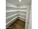 Well-lit pantry offering generous storage solutions at 26034 S Glenburn Dr, Sun Lakes, AZ 85248