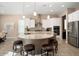 Modern kitchen with large island, stainless steel appliances, and white cabinets at 26783 W Piute Ave, Buckeye, AZ 85396