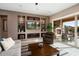 Living room with built-in shelving, large TV, and comfortable seating at 26783 W Piute Ave, Buckeye, AZ 85396