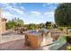 Built-in outdoor kitchen with a grill and stone countertops at 26783 W Piute Ave, Buckeye, AZ 85396