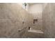 Large walk-in shower with built-in seat and grab bar at 26783 W Piute Ave, Buckeye, AZ 85396