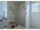 Bathroom with a walk-in shower and a view into a bedroom at 31063 W Cheery Lynn Rd, Buckeye, AZ 85396