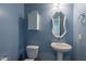 Clean bathroom with pedestal sink, toilet and a medicine cabinet at 31063 W Cheery Lynn Rd, Buckeye, AZ 85396