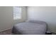 Bedroom with a queen bed and window at 31063 W Cheery Lynn Rd, Buckeye, AZ 85396