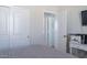 Bright bedroom with double doors and ensuite bathroom at 31063 W Cheery Lynn Rd, Buckeye, AZ 85396