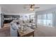 Spacious living room features a comfy sectional sofa and a view into the kitchen at 31063 W Cheery Lynn Rd, Buckeye, AZ 85396