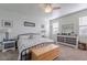 Main bedroom with a king-size bed, dresser, and ceiling fan at 31063 W Cheery Lynn Rd, Buckeye, AZ 85396