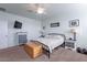 Main bedroom with a king bed, dresser and ceiling fan at 31063 W Cheery Lynn Rd, Buckeye, AZ 85396