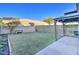 Backyard with grassy area, covered patio, and block wall at 3134 E Mckellips Rd # 168, Mesa, AZ 85213