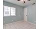 Bright bedroom with tile floor, large window, and double door closet at 3134 E Mckellips Rd # 168, Mesa, AZ 85213