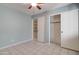 Bedroom with ceiling fan, light blue walls, and double door closet at 3134 E Mckellips Rd # 168, Mesa, AZ 85213