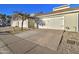 Exterior view of attached garages with driveway and landscaping at 3134 E Mckellips Rd # 168, Mesa, AZ 85213