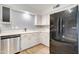 Cozy kitchen featuring white cabinets, stainless steel appliances, and light countertops at 3134 E Mckellips Rd # 168, Mesa, AZ 85213