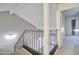 Loft hallway with carpet flooring and metal railing at 3134 E Mckellips Rd # 168, Mesa, AZ 85213