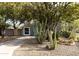 Cute bungalow with light blue exterior, gravel driveway, and desert landscaping at 3715 N 9Th Pl, Phoenix, AZ 85014