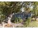 Quaint bungalow with light blue exterior, mature trees, and xeriscaped landscaping at 3715 N 9Th Pl, Phoenix, AZ 85014