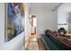 Hallway with artwork, wood floors and view of bathroom at 3715 N 9Th Pl, Phoenix, AZ 85014