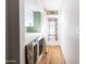 Stackable washer and dryer in a laundry room with white cabinets at 3715 N 9Th Pl, Phoenix, AZ 85014