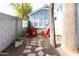 Red chairs and fire pit on a gravel patio at 3715 N 9Th Pl, Phoenix, AZ 85014