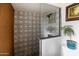 Modern shower with patterned tile walls and pebble floor at 3715 N 9Th Pl, Phoenix, AZ 85014