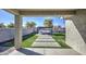 Backyard with pergola, fire pit, and artificial turf at 3740 S 182Nd Ln, Goodyear, AZ 85338