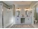 Modern bathroom with double vanity, farmhouse style mirrors, and a walk-in shower at 3740 S 182Nd Ln, Goodyear, AZ 85338