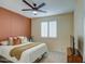 Bedroom with an accent wall and a ceiling fan at 3740 S 182Nd Ln, Goodyear, AZ 85338