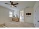 Bright bedroom with ensuite bathroom access and dresser at 3740 S 182Nd Ln, Goodyear, AZ 85338