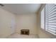 Small bedroom with rustic wood accent table and window shutters at 3740 S 182Nd Ln, Goodyear, AZ 85338