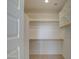 Large walk-in closet with double hanging rods and shelves at 3740 S 182Nd Ln, Goodyear, AZ 85338