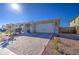 Single-story home with a two-car garage and landscaped front yard at 3740 S 182Nd Ln, Goodyear, AZ 85338