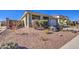 House with a gravel front yard and drought-tolerant landscaping at 3740 S 182Nd Ln, Goodyear, AZ 85338